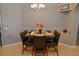 Stylish dining area with seating for six, a modern chandelier, and neutral walls at 2807 Playing Otter Ct, Kissimmee, FL 34747
