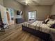 Comfortable main bedroom with a sliding door to the outside and en-suite bath at 2807 Playing Otter Ct, Kissimmee, FL 34747