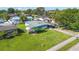 An aerial view displays the home's lush lawn and surrounding neighborhood at 2830 W Oak St, Kissimmee, FL 34741