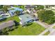 An aerial view displays the home's lush lawn and surrounding neighborhood at 2830 W Oak St, Kissimmee, FL 34741
