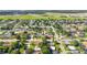 An aerial view of a residential area near an airport, showcasing tidy neighborhood layouts at 2830 W Oak St, Kissimmee, FL 34741