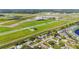 Picturesque neighborhood with private pools, lush trees, and proximity to an airfield at 2830 W Oak St, Kissimmee, FL 34741
