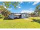 Picturesque backyard with vibrant lawn and view of the house, perfect for outdoor enjoyment and curb appeal at 2830 W Oak St, Kissimmee, FL 34741