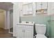 Bathroom features a vanity with storage, mirror, medicine cabinet, toilet, and doorway to closet at 2830 W Oak St, Kissimmee, FL 34741