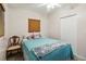 Bright bedroom featuring a blue comforter, wood blinds, and ample natural light for a relaxing space at 2830 W Oak St, Kissimmee, FL 34741