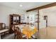 Inviting dining room with terrazzo flooring, built-in shelving, and access to the kitchen at 2830 W Oak St, Kissimmee, FL 34741