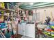 Utility room featuring a washer, dryer, shelving, and an organized space for laundry tasks at 2830 W Oak St, Kissimmee, FL 34741