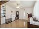 Cozy living room featuring polished floors, ample natural light, and classic furnishings at 2830 W Oak St, Kissimmee, FL 34741