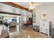 Spacious living area with terrazzo floors, connecting to a dining area and a bright living space at 2830 W Oak St, Kissimmee, FL 34741