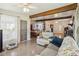 Inviting living room with exposed beam, open to dining, and a white recliner for comfortable relaxation at 2830 W Oak St, Kissimmee, FL 34741