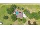 Overhead shot of property with home, pool, and lush tree coverage at 3181 Canter Ln, Kissimmee, FL 34746