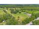 Expansive property featuring a well-maintained home, mature trees, and ample space for outdoor activities at 3181 Canter Ln, Kissimmee, FL 34746