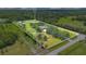 Large property showcasing a home, lush greenery, mature trees, and ample space for outdoor living and recreation at 3181 Canter Ln, Kissimmee, FL 34746