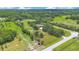 Sprawling property features lush greenery, mature trees, and a well-maintained home in a serene, rural setting at 3181 Canter Ln, Kissimmee, FL 34746