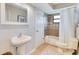 Bathroom features a single sink and a shower-tub combo with tiled walls at 3181 Canter Ln, Kissimmee, FL 34746