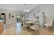 Elegant dining area with a chandelier, vaulted ceiling, and access to the backyard, perfect for Gathering gatherings at 3181 Canter Ln, Kissimmee, FL 34746