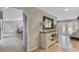 Foyer with tile flooring, decorative mirror, and a view into the dining room at 3181 Canter Ln, Kissimmee, FL 34746