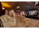 Immersive home theater with tiered seating, a large screen, and professional sound system for the ultimate viewing experience at 3181 Canter Ln, Kissimmee, FL 34746