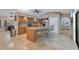 Stunning kitchen featuring a large island, custom cabinets, stainless steel appliances, and an open design for entertaining at 3181 Canter Ln, Kissimmee, FL 34746