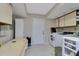 Laundry room featuring a washing machine, dryer, utility sink and storage at 3181 Canter Ln, Kissimmee, FL 34746