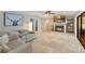 Living room featuring a fireplace, ceiling fan, mounted tv, and comfortable seating at 3181 Canter Ln, Kissimmee, FL 34746
