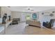 Bright living room with tile floors and an arched alcove for the television at 3181 Canter Ln, Kissimmee, FL 34746