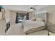 Bedroom with a decorative fireplace, a view of the backyard pool and furniture at 3181 Canter Ln, Kissimmee, FL 34746