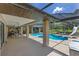 The covered patio includes a large pool with a slide, and an outdoor dining area at 3181 Canter Ln, Kissimmee, FL 34746