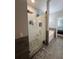 A modern walk-in shower features custom tile and a glass enclosure at 3339 Primrose Willow Dr, St Cloud, FL 34773