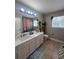 Bathroom featuring a single vanity and a combination shower and tub at 3339 Primrose Willow Dr, St Cloud, FL 34773