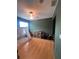 Bedroom features wood floors, neutral walls, a ceiling fan, and play tent setup at 3339 Primrose Willow Dr, St Cloud, FL 34773