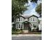 Inviting two-story home featuring a lush front yard and a classic American flag display at 3339 Primrose Willow Dr, St Cloud, FL 34773