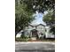 Charming two-story home with mature trees, green lawn, and inviting curb appeal at 3339 Primrose Willow Dr, St Cloud, FL 34773