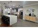 Modern kitchen featuring a large island with seating and stainless steel appliances at 3339 Primrose Willow Dr, St Cloud, FL 34773