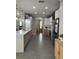 Modern kitchen featuring stainless steel appliances, a large island, and ample cabinet space at 3339 Primrose Willow Dr, St Cloud, FL 34773
