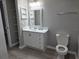 Bright bathroom with a white vanity, open shelving, and a neutral color scheme, offering a clean and modern aesthetic at 3428 Soho St # 208, Orlando, FL 32835