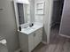 Modern bathroom features a new vanity with a white countertop and a bright mirror at 3428 Soho St # 208, Orlando, FL 32835