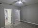 View of the bedroom leading to the ensuite bath and walk-in closet at 3428 Soho St # 208, Orlando, FL 32835