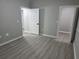 A bright bedroom featuring gray walls and modern floors, offering a calm and neutral atmosphere at 3428 Soho St # 208, Orlando, FL 32835