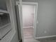 Walk-in closet with wire shelving for clothing storage in a neutral-colored room at 3428 Soho St # 208, Orlando, FL 32835