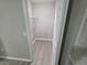 A walk-in closet, providing plenty of storage space with wire shelves and a bright interior at 3428 Soho St # 208, Orlando, FL 32835