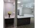 Kitchen and adjacent eating area, featuring white cabinets, stainless steel appliances and quartz countertops at 3428 Soho St # 208, Orlando, FL 32835