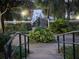 Well-maintained walking path leading to pier at a community amenity at 3428 Soho St # 208, Orlando, FL 32835