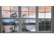 A window offers a beautiful view of the lake at sunset at 3428 Soho St # 208, Orlando, FL 32835