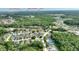 Aerial view of the neighborhood showcasing a home in a lush residential area at 373 Shady Oak Loop, Davenport, FL 33896