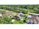 Aerial view of the home with an enclosed pool and lush greenery at 373 Shady Oak Loop, Davenport, FL 33896