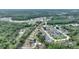 Aerial view of homes surrounded by lush greenery, creating a serene and private atmosphere at 373 Shady Oak Loop, Davenport, FL 33896