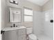 Clean bathroom featuring a single vanity, a well lit mirror, and shower at 373 Shady Oak Loop, Davenport, FL 33896
