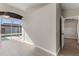 Dining area with backyard pool access through sliding glass doors, adjacent to an open doorway at 373 Shady Oak Loop, Davenport, FL 33896