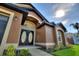 Attractive house exterior with a double door entry and manicured landscaping at 373 Shady Oak Loop, Davenport, FL 33896